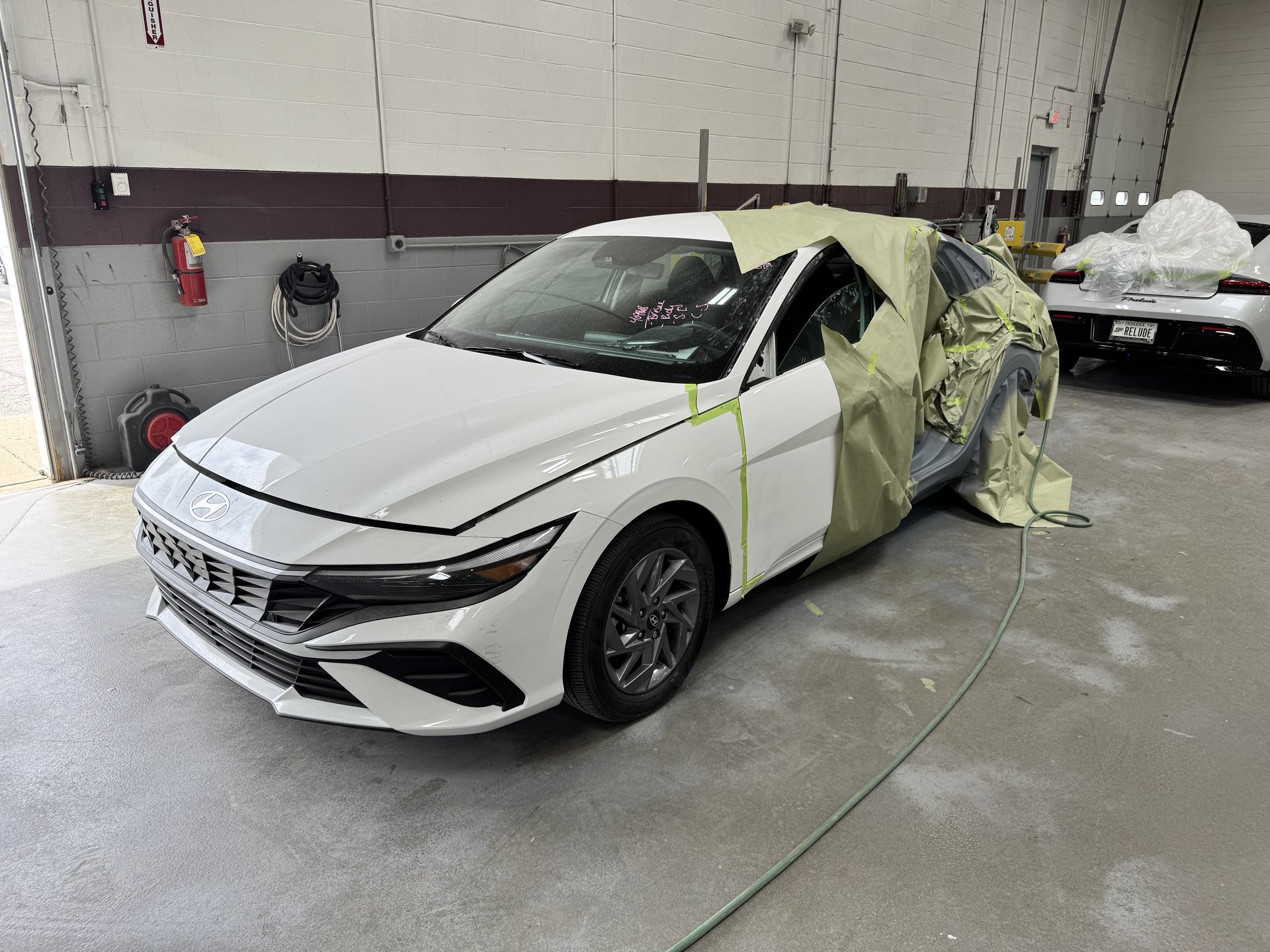 2025 Hyundai Elantra fully masked and ready for paint at Bob Rohrman Collision Repair Center in Lafayette, Indiana