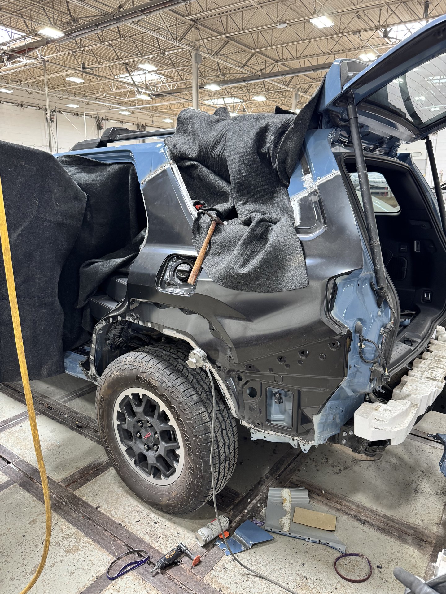 2025 Toyota 4Runner with rear driver-side collision damage during disassembly at Bob Rohrman Collision Repair Center in Lafayette, Indiana