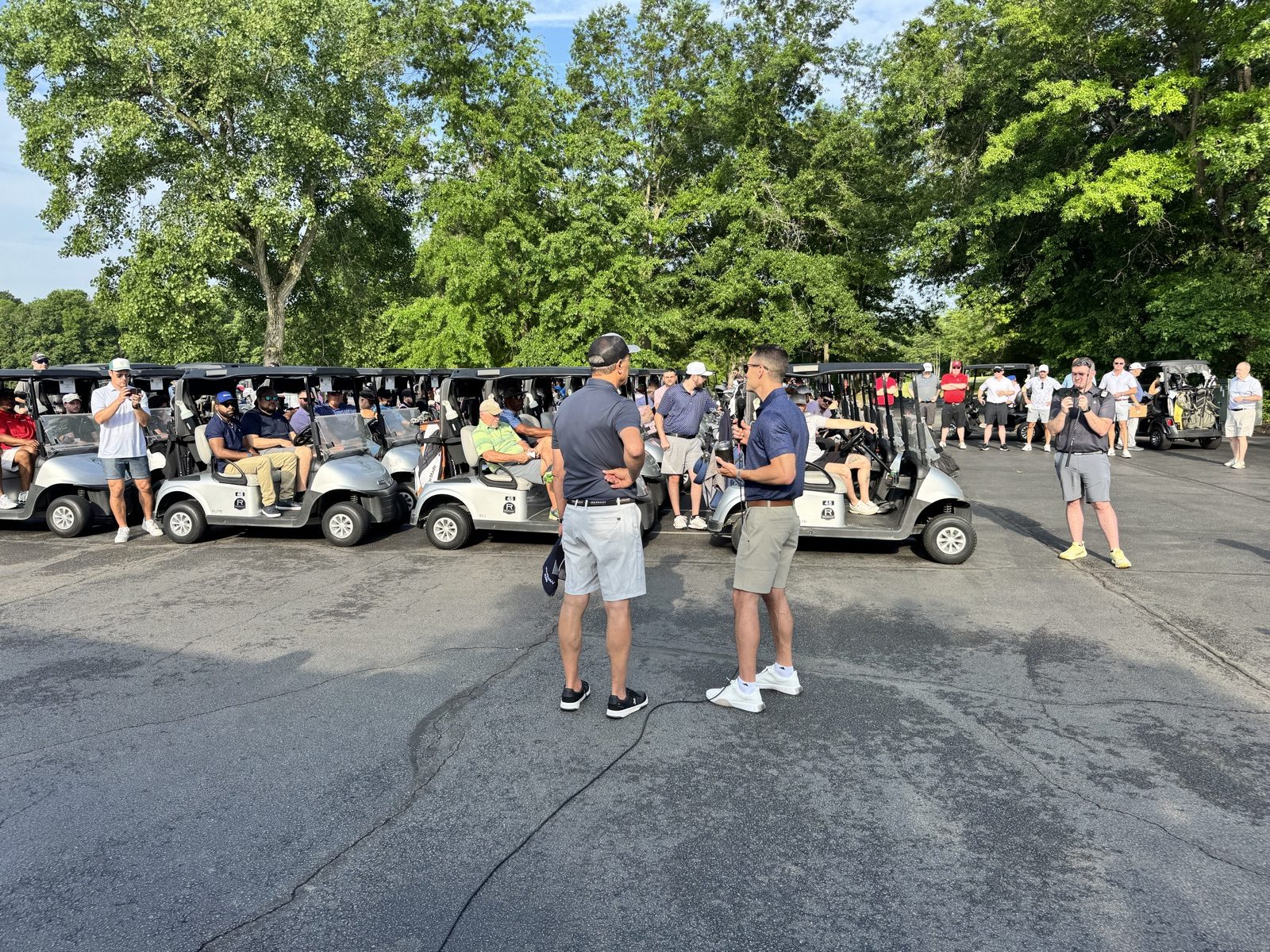 Golfers and Rohrman team members gathered by the carts before the Restored foundation scramble at Coyote Crossing in West Lafayette, Indiana