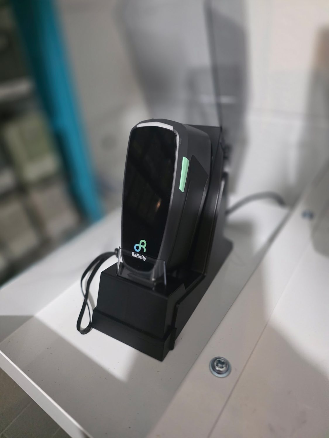 New BASF Refinity handheld paint color scanner in its dock in the remodeled mixing room at Bob Rohrman Collision Repair Center, Lafayette IN