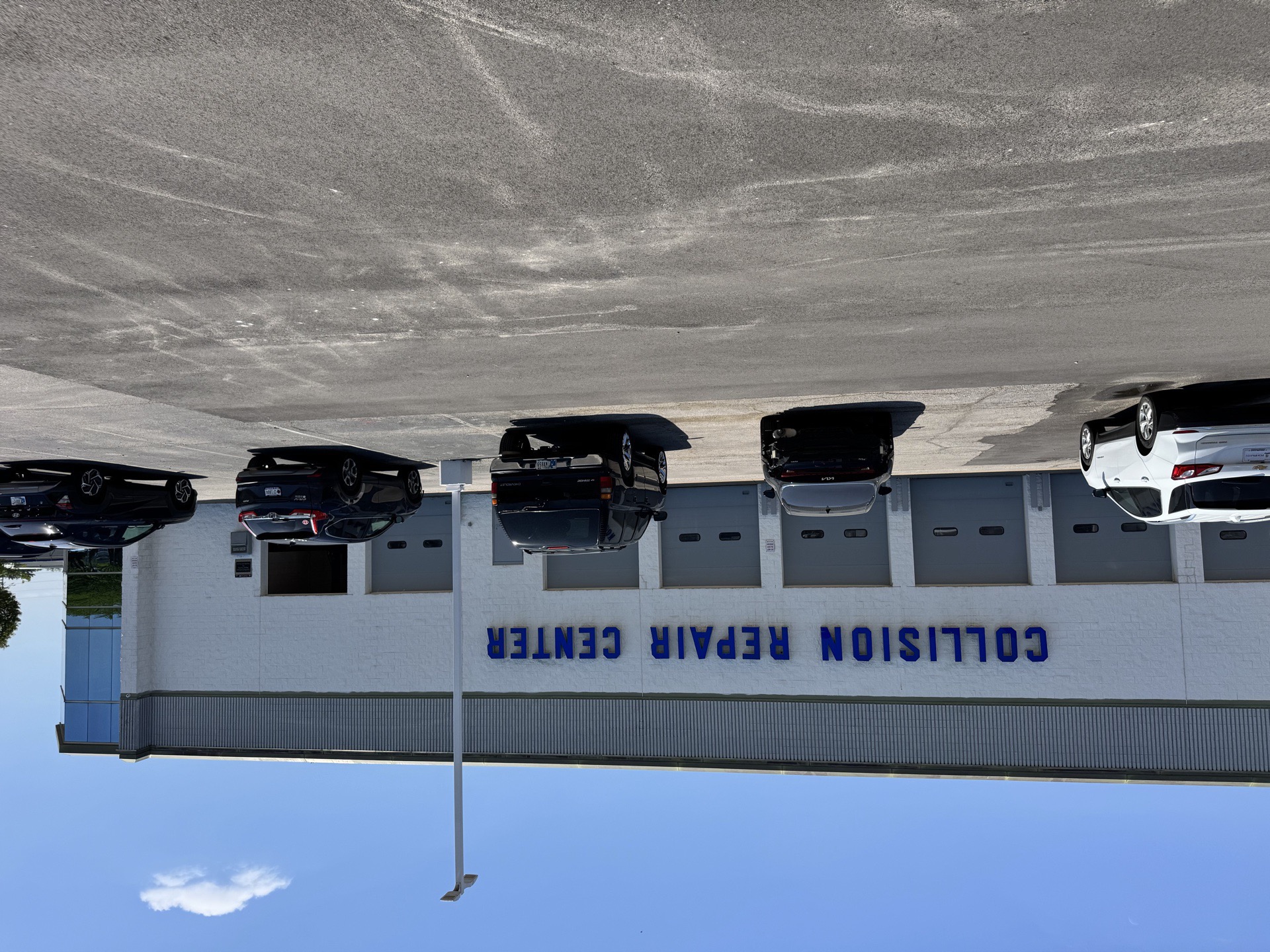 Side exterior of the Bob Rohrman Collision facility showing customer entrance in Lafayette IN