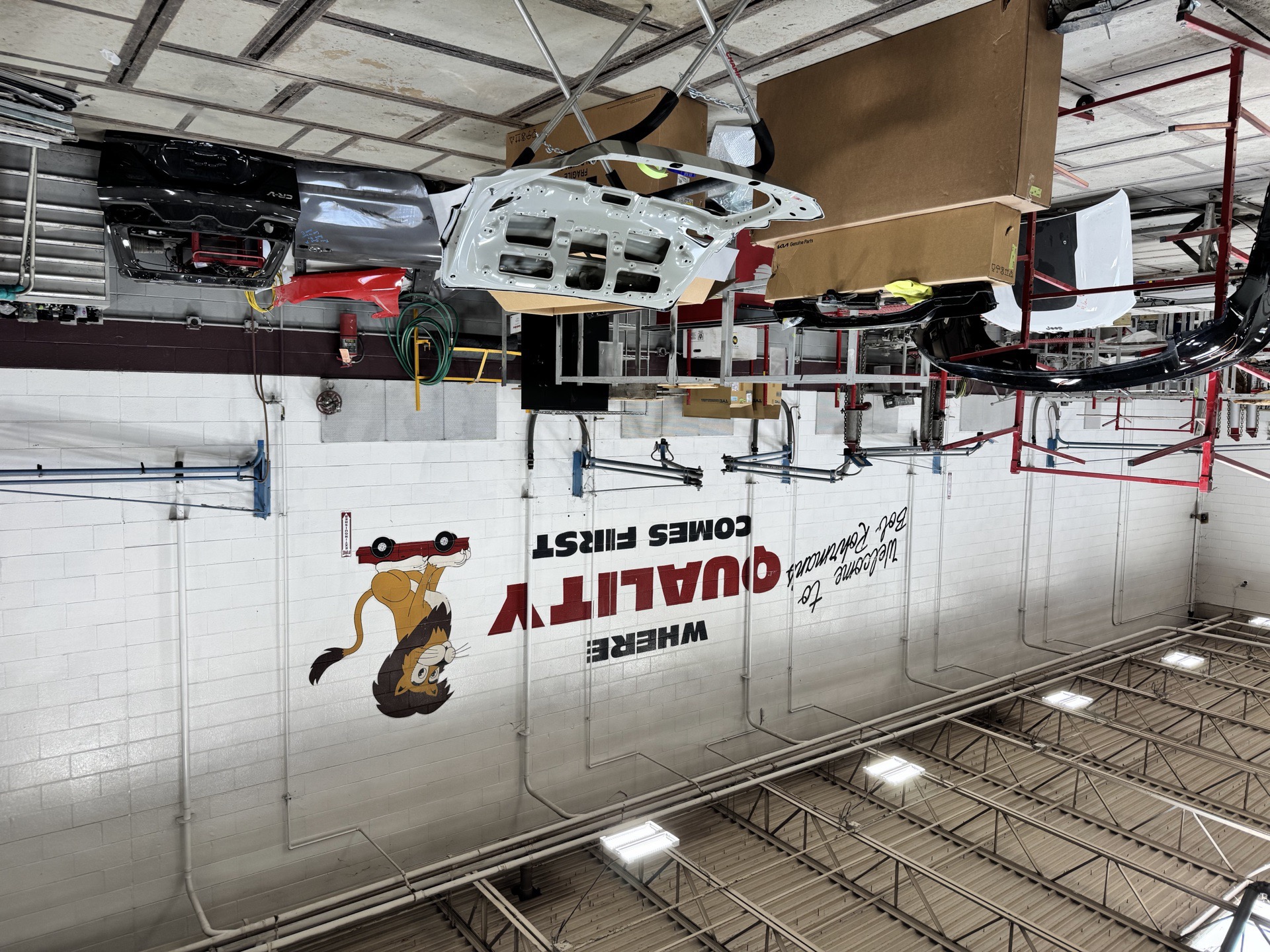 Interior of the collision repair bays at Bob Rohrman Collision in Lafayette, Indiana